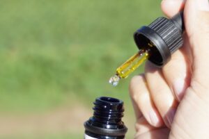 Athlete with CBD in a dropper